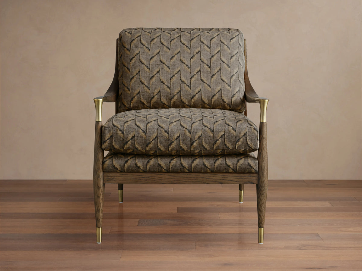 Fisher Chair: Dark wood frame with mocha finish, beige & brown geometric patterned upholstery, brass accents on legs & arms.
