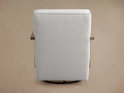 Walsh Glider in light gray fabric with wooden armrests, shown from a rear angle on a brown background. Circular black swivel base visible.