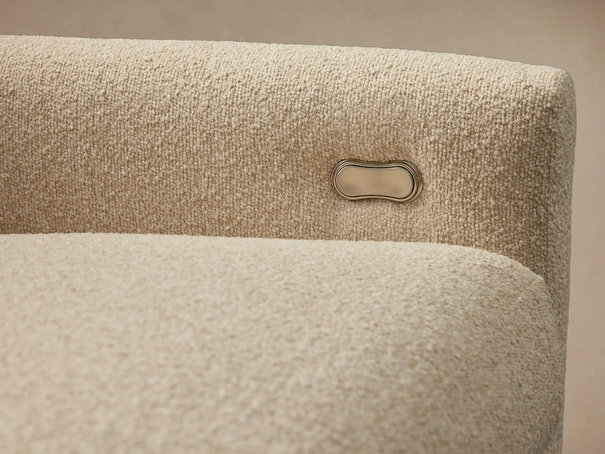 Kipton Three-Piece Motion Modular Sofa in a light beige fabric, featuring slim arms and three cushioned seats and backrests on a wooden floor.