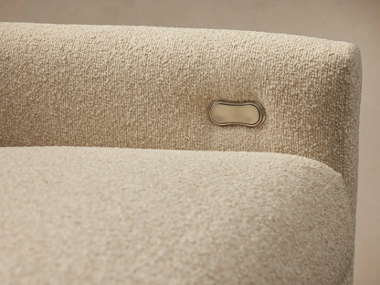 Kipton Three-Piece Motion Modular Sofa in a light beige fabric, featuring slim arms and three cushioned seats and backrests on a wooden floor.