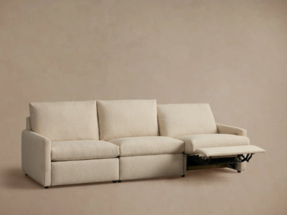 Kipton Three-Piece Motion Modular Sofa in beige fabric with two extended footrests and slim arms, set against a neutral background.