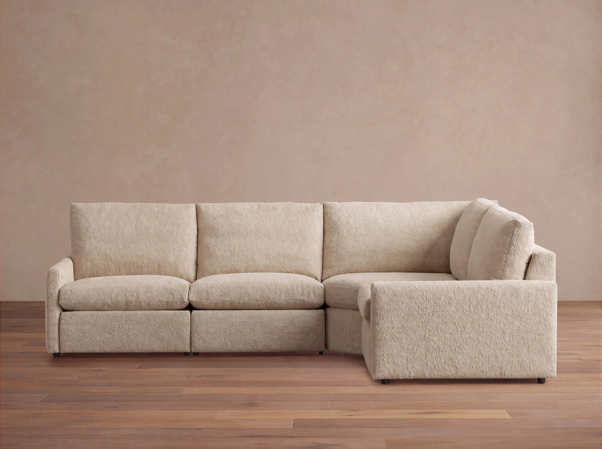 Kipton Upholstered 126"W Four Piece Left Arm Motion Sectional in Promise Ecru (1 of 1)