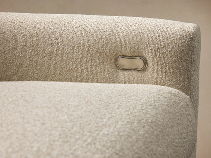 Kipton Four-Piece Motion Modular Sofa in beige fabric, featuring sleek design with slim arms, set on a wooden floor.