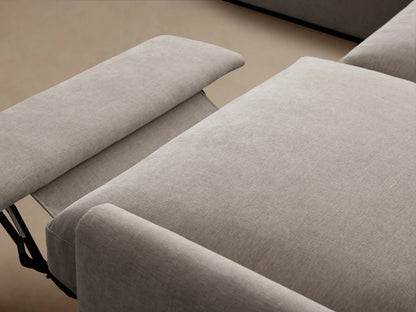Alt text: The Kipton Five-Piece Motion Corner Sectional in a neutral beige fabric, featuring slim arms and plush cushions, arranged in an L-shape on a wooden floor.