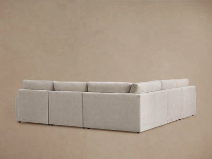Kipton Five-Piece Motion Corner Sectional in beige fabric, partially reclined with visible footrest; smooth, cushioned surface.