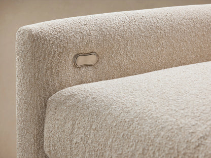 Kipton Six-Piece Motion Sectional in light beige fabric, L-shaped with six seats, slim arms, set on wooden floor.