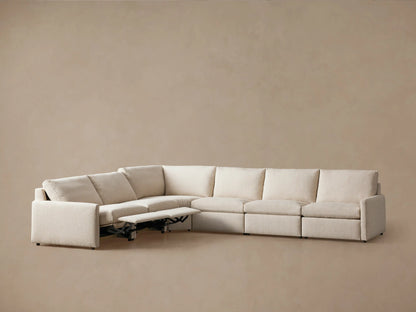 Kipton Six-Piece Motion Sectional in light beige fabric, L-shaped, with three seats reclined and slim arms, on a neutral background.