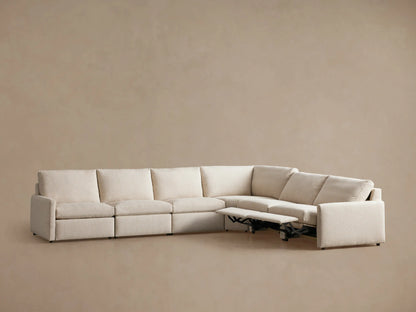 Kipton Slim Arm Six-Piece Motion Sectional in light beige fabric, L-shaped, with three left footrests extended.