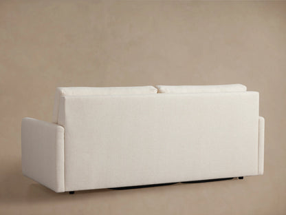 The Kipton Luxury Sleeper Sofa in beige fabric, partially unfolded to show its pull-out mechanism and mattress components.