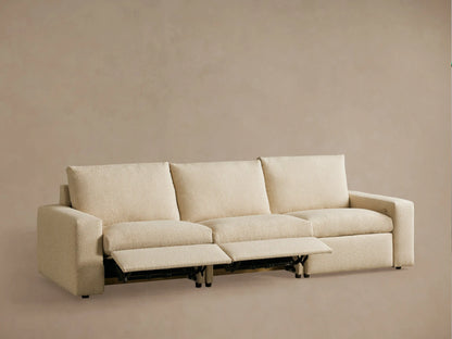 Rear view of the Kipton Wide Arm Three-Piece Motion Modular Sofa in beige fabric, showing wide arms and rectangular backrests.
