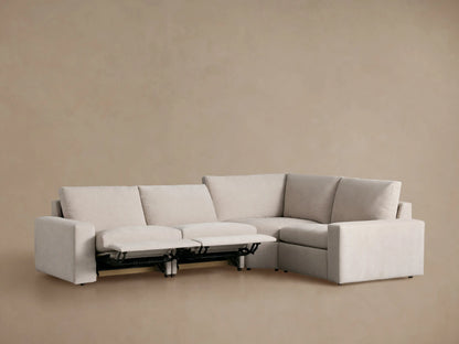 Kipton Wide Arm Four-Piece Motion Sectional in light beige fabric, L-shaped, with two footrests extended.