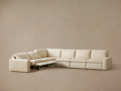 Kipton Wide Arm Six Piece Motion Sectional in beige fabric, L-shaped with wide arms, two reclined footrests, shown against a neutral background.