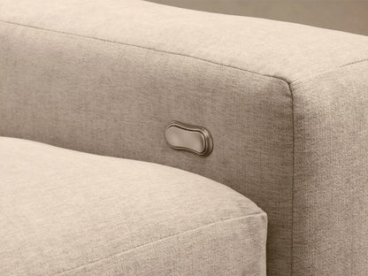 Kipton Wide Arm Six-Piece Motion Sectional, upholstered in light beige fabric, arranged in an L-shape on a wood floor.