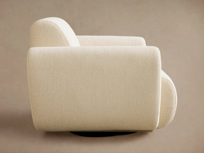 Light cream Gianni Swivel Chair, angled back view. Textured fabric, curved back and armrests, against a plain background.