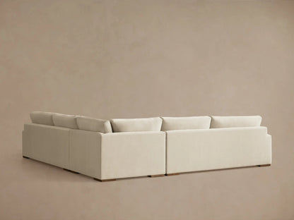 Norwalk Three-Piece Corner Sectional in a neutral beige fabric, featuring plush cushions, large armrest, and modern design.