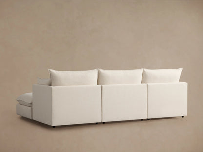 Owen Four-Piece Sectional featuring a light beige fabric, close-up of plush seat cushion and slightly tilted backrest cushion.