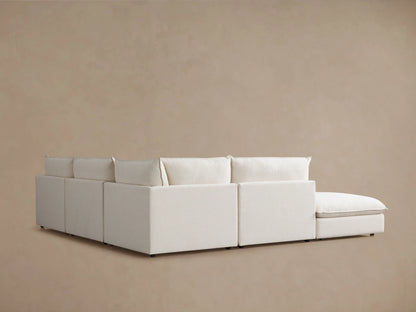 Cream-colored Owen Five-Piece Sectional close-up showing soft, plush seat and back cushions with smooth, clean lines.