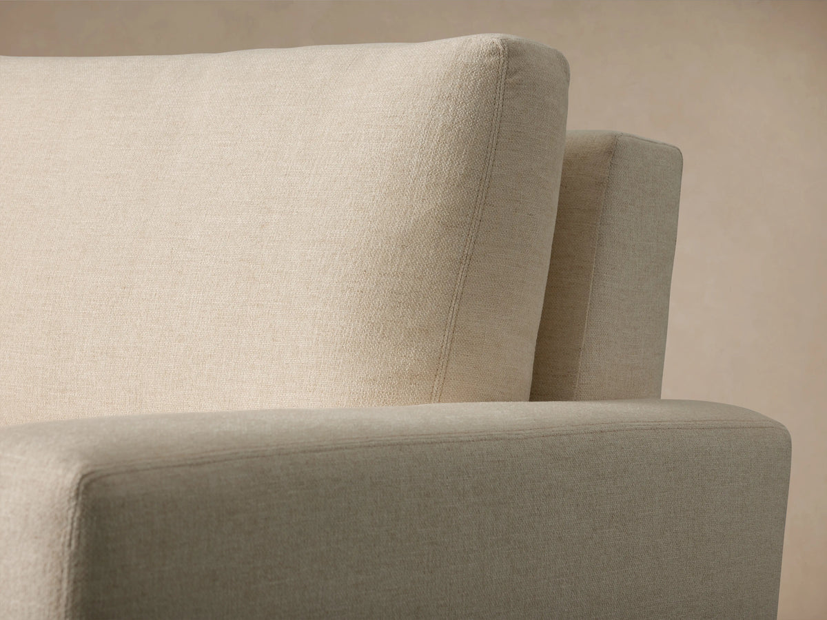 Remington Luxury Sleeper Sofa with its cream quilted mattress pulled out, showing 'Zarevium' on the light beige front flap.