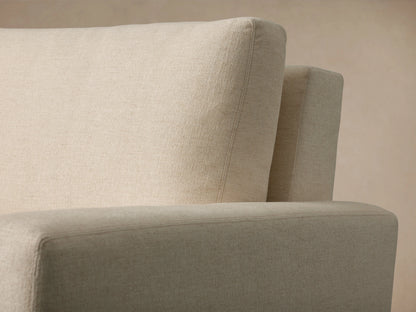 Remington Luxury Sleeper Sofa with its cream quilted mattress pulled out, showing 'Zarevium' on the light beige front flap.