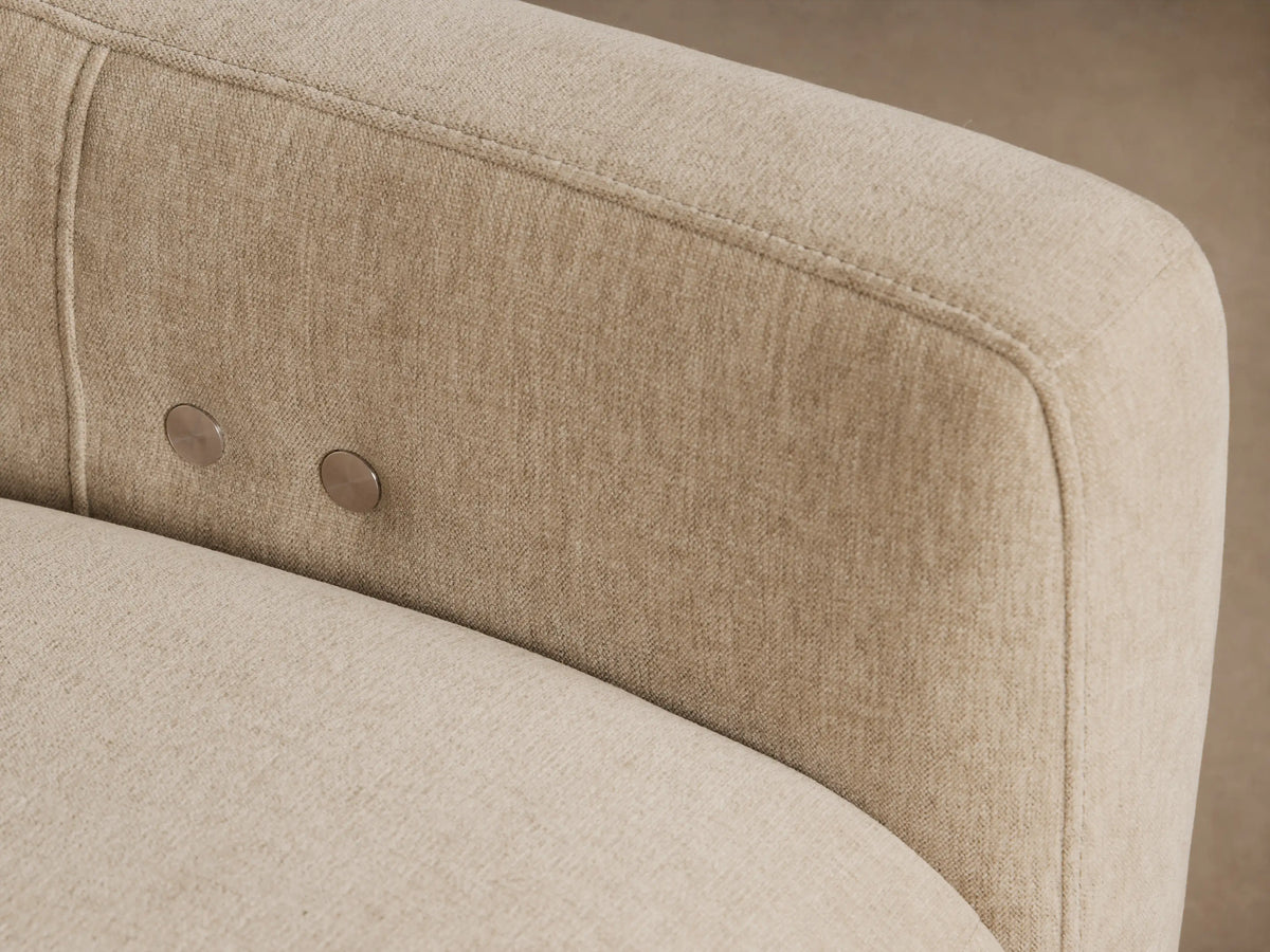 Rowland Tailored Three-Piece Motion Modular Sofa in light beige textured fabric, full front view against a tan wall.