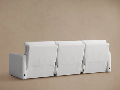 Close-up of a light gray Rowland Modular Sofa, showing the left armrest & segmented back cushions in textured fabric.