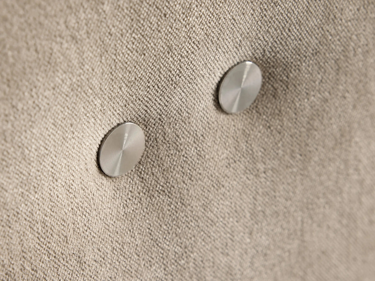 Rowland Tailored Four-Piece Armless Motion Modular Sofa, light oat fabric. Four armless sections, leftmost slightly reclined.