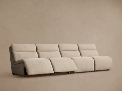 Close-up of Rowland Tailored Modular Sofa's light beige upholstered seat cushion, backrest, and two silver buttons.