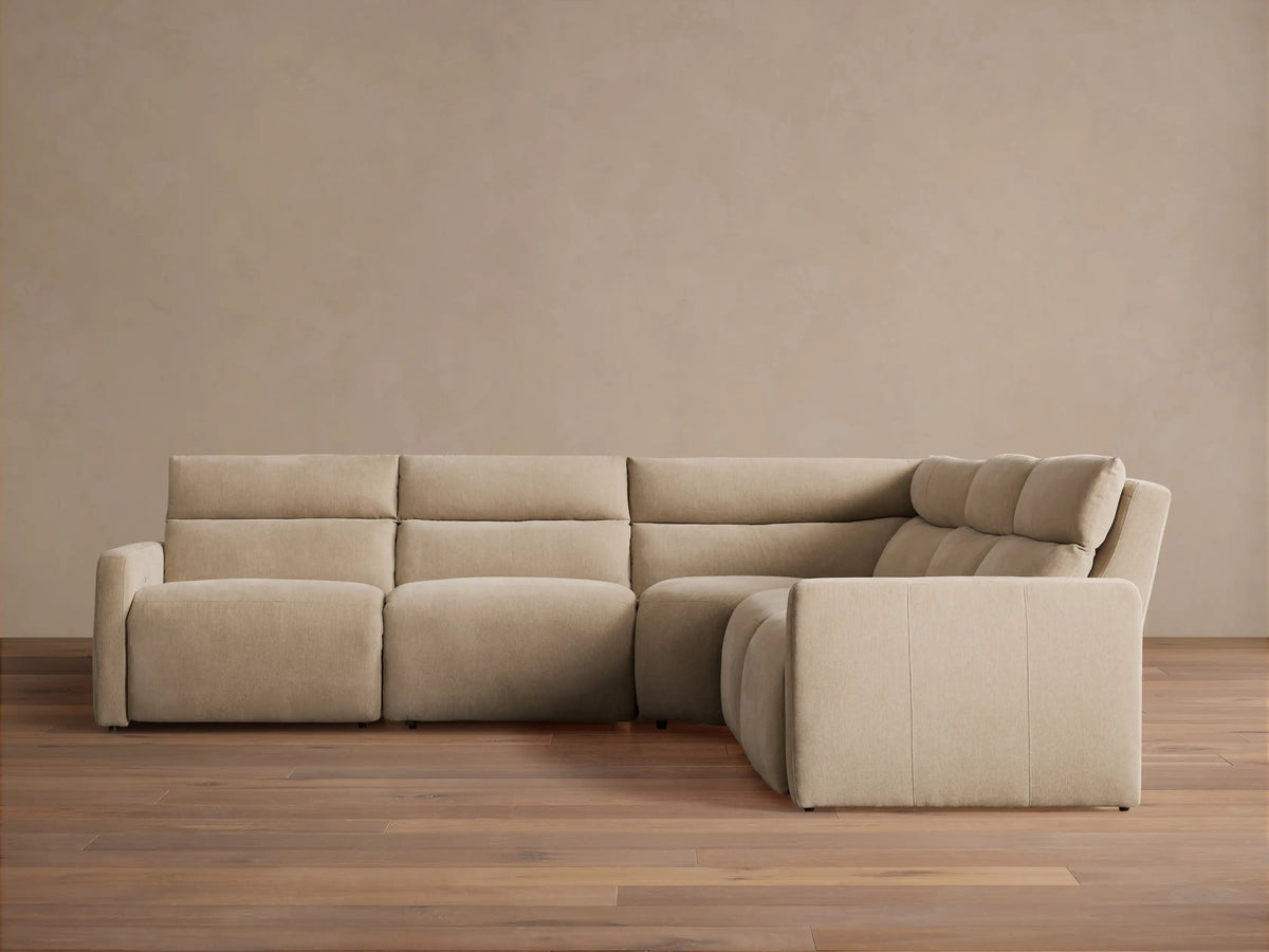 Rowland Tailored Five-Piece Motion Corner Sectional in light beige fabric, L-shaped, right section slightly reclined.