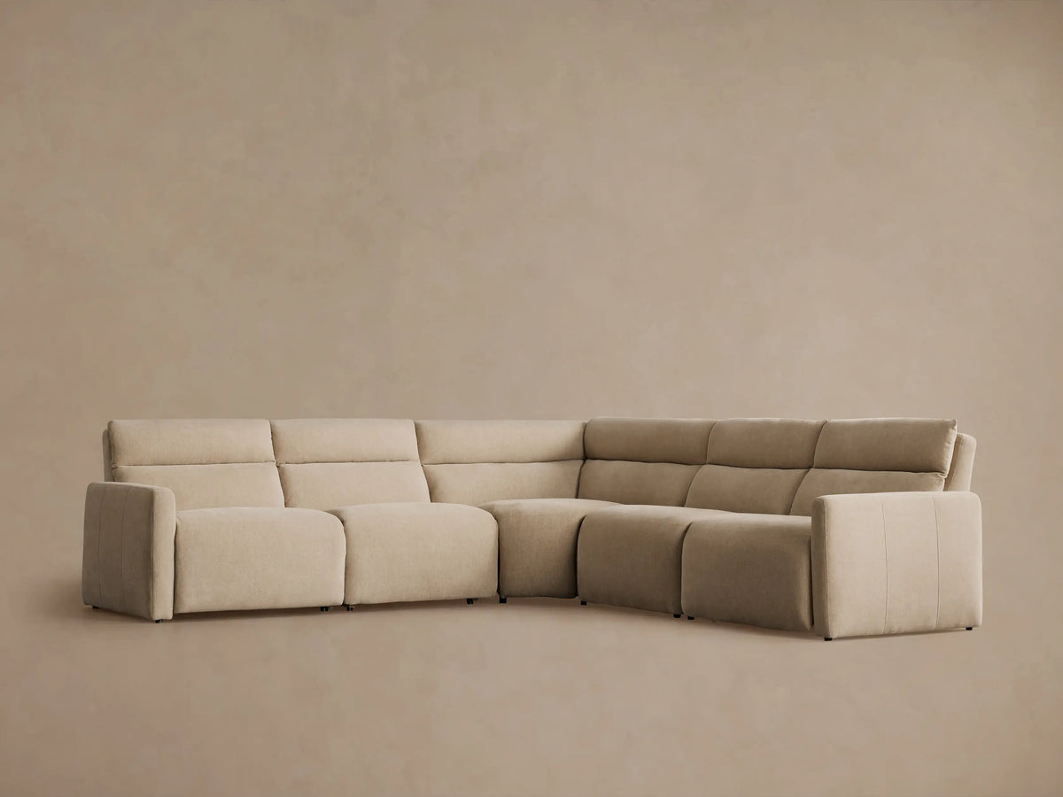 Rowland Tailored Five-Piece Motion Corner Sectional in light beige fabric, L-shaped, right section slightly reclined.
