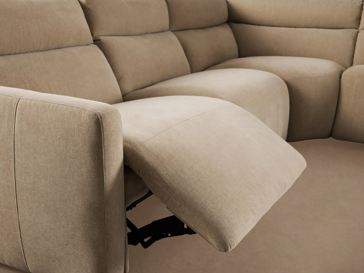Close-up of Rowland Tailored Five-Piece Motion Corner Sectional in light beige textured fabric with two metallic buttons.