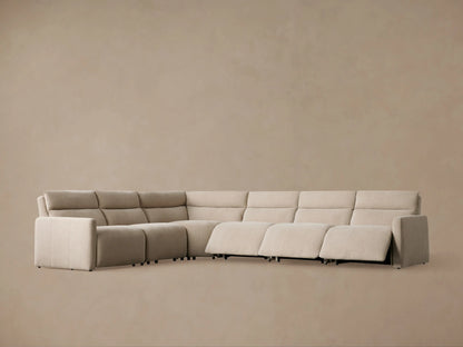 Close-up of Rowland Tailored Sectional in light beige, showing textured fabric on seat, armrest, and base with two silver buttons.