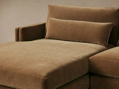 Front view of a golden-brown velvet Sumner Two-Piece Chaise Sectional with a left-facing chaise and three lumbar pillows.