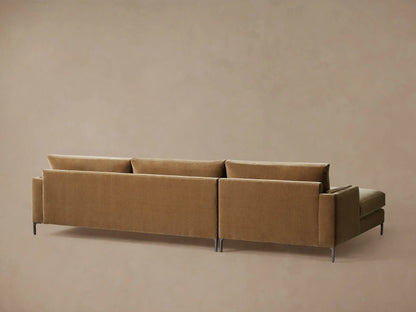 Close-up of the brown plush Sumner Two-Piece Chaise Sectional, showing the chaise, armrest, backrest, and lumbar toss pillow.