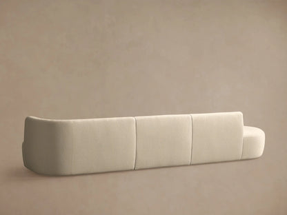 Lovina Three-Piece Bumper Sectional in cream boucle fabric, angled view of rounded armrest and plush back & seat cushions.