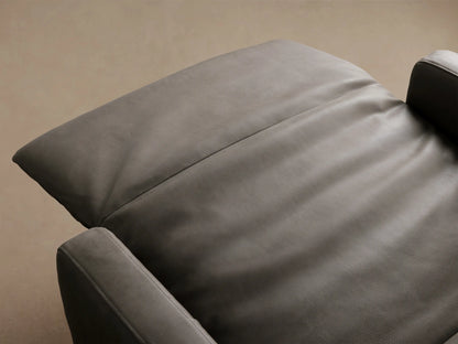 Rowland Tailored Leather High-Back Motion Recliner, slate gray, front view, on a wooden floor.