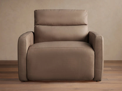 Taupe Rowland Tailored Leather High-Back Motion Recliner with visible stitching, standing on a hardwood floor against a light wall.