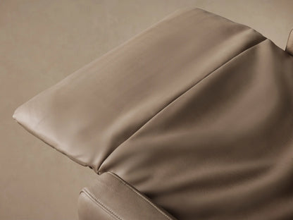 Close-up of Rowland Recliner's textured taupe leather with two recessed silver power buttons & vertical stitching.