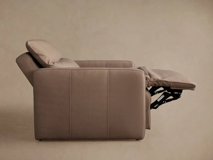 Rowland Tailored high-back motion recliner in two-tone taupe leather, reclined with extended footrest, front-right view.