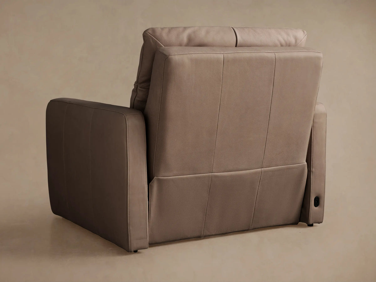 Side view of Rowland Tailored Leather High-Back Motion Recliner in taupe, fully reclined with footrest extended.
