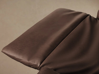 Frontal view of a tailored, high-back Rowland motion recliner in rich brown leather, centered on a wood floor.