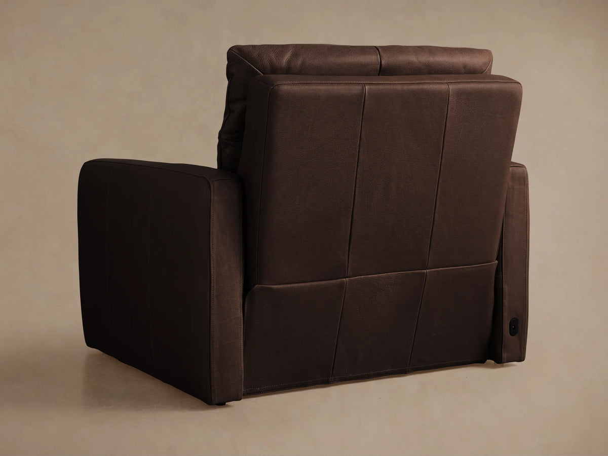 Dark brown tailored leather Rowland high-back motion recliner, shown fully reclined from a side view.