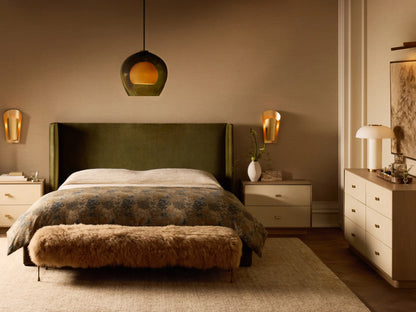Front view of the Tan Gwen Mongolian Shearling Bench, covered in textured shearling, with four slender hand-painted brass finish legs.