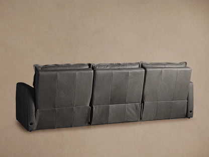 Rowland Leather Three-Piece Motion Modular Sofa in soft gray, featuring plush backrests and sturdy armrests, set against a neutral background.