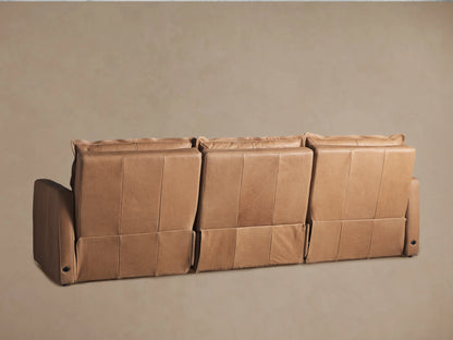 Rowland Leather Three-Piece Motion Modular Sofa in tan leather, featuring padded seat and backrests, with visible stitching on broad armrests.