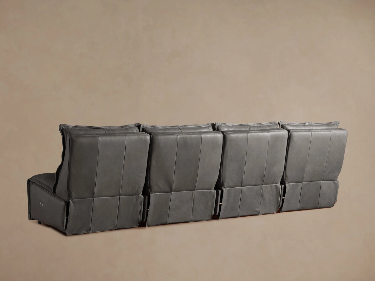 Rowland Leather Four-Piece Armless Motion Modular Sofa in gray leather shown from the back, displaying four connected reclining sections.