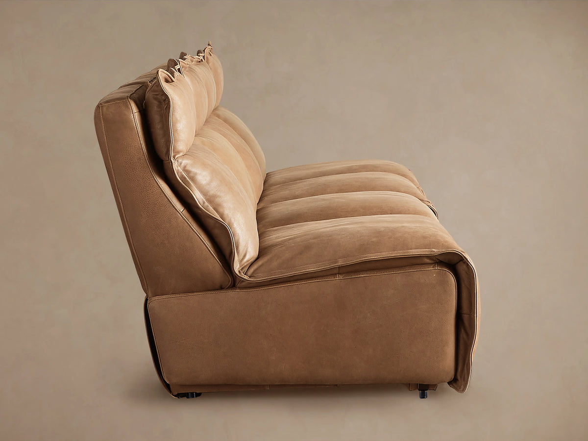 Rowland Leather Four-Piece Armless Motion Modular Sofa in tan leather, side view showing plush cushions and sleek armless design.