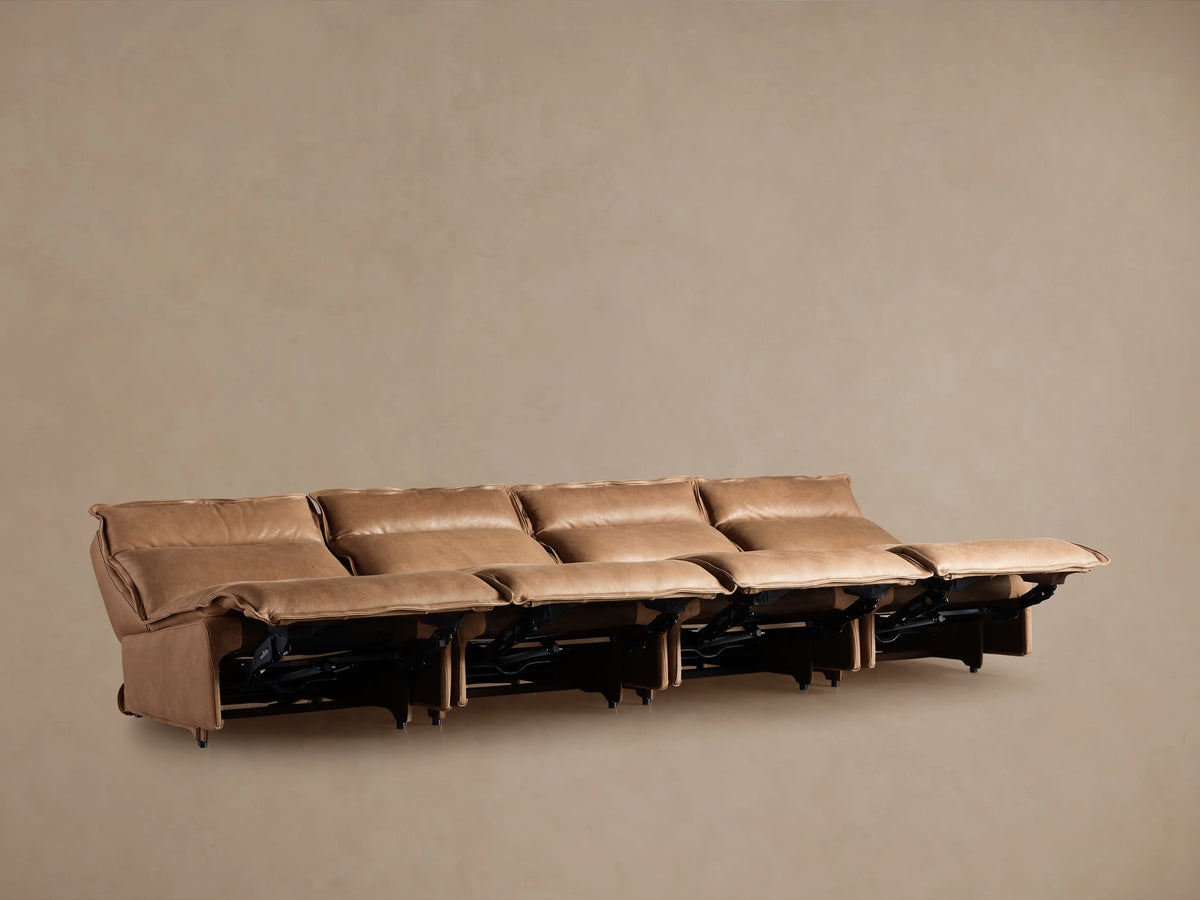 Rowland Leather Four-Piece Armless Motion Modular Sofa in brown leather, reclined position showing footrests elevated, set against a plain background.