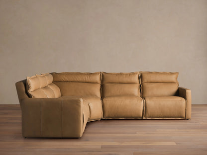 Tan Rowland Leather Five-Piece Motion Corner Sectional on wood floor, showcasing plush backrests and cushioned seats in an L-shaped layout.