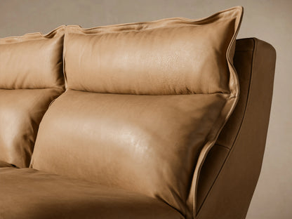 Rowland Leather Five-Piece Motion Corner Sectional in tan leather, consisting of five sections arranged in an L-shape on a wooden floor.