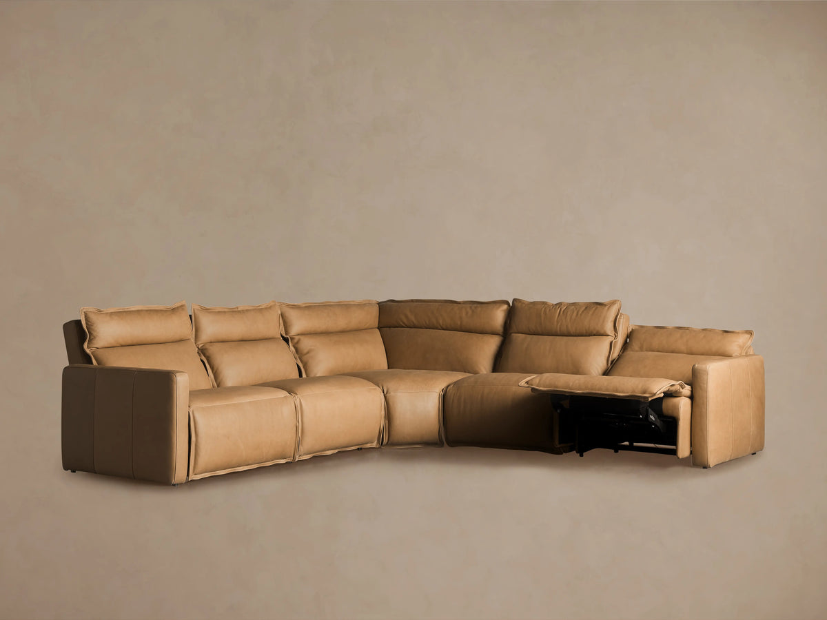 Rowland Leather Five-Piece Motion Corner Sectional in tan leather, viewed from the back, forming an L-shape against a neutral background.